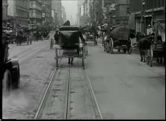 Cable car approaches a busy Market Street crossing